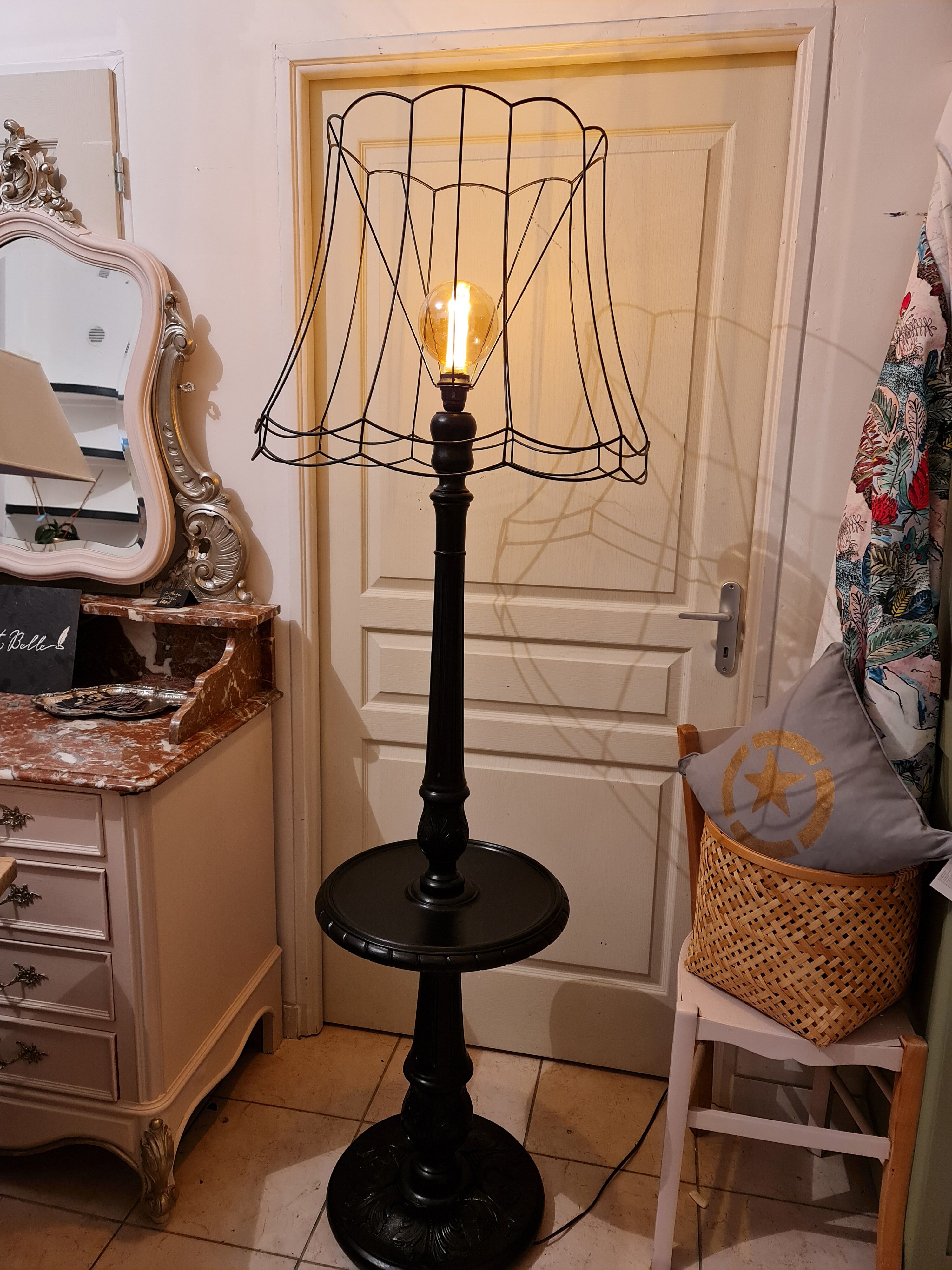 Matte black lamppost with small tablet