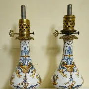 Gien: pair of antique oil lamps in fine earthenware richly decorated.