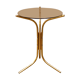 Golden pedestal table in smoked glass