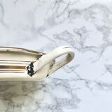 Old egg dish in creamy white and golden enamelled sheet