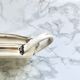 Old egg dish in creamy white and golden enamelled sheet