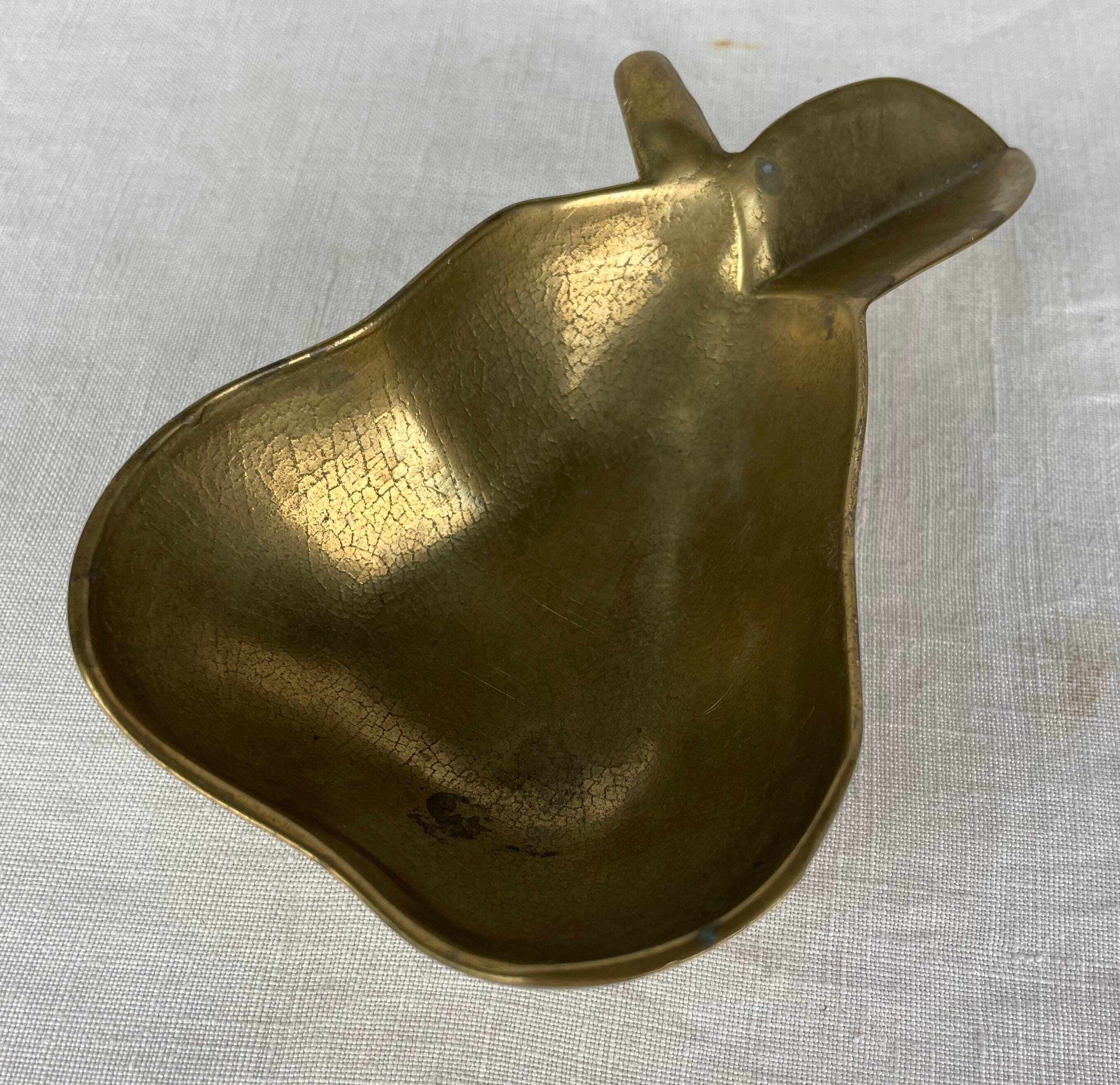 Empty pocket ashtray in pear-shaped brass