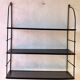 Black metal string shelf