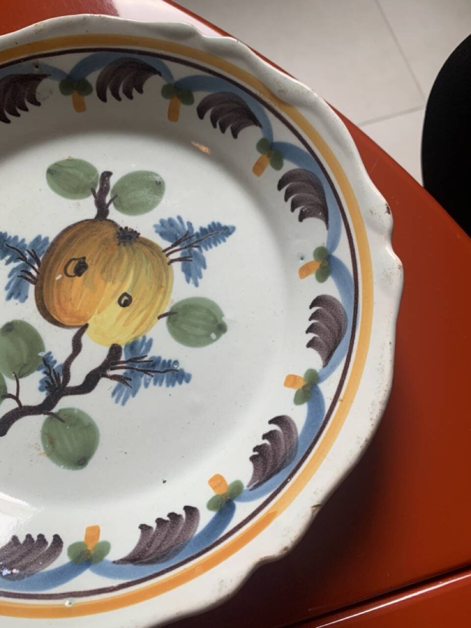 Antique earthenware soup plate with plum decoration