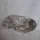 Shell-shaped crystal paperweight.
