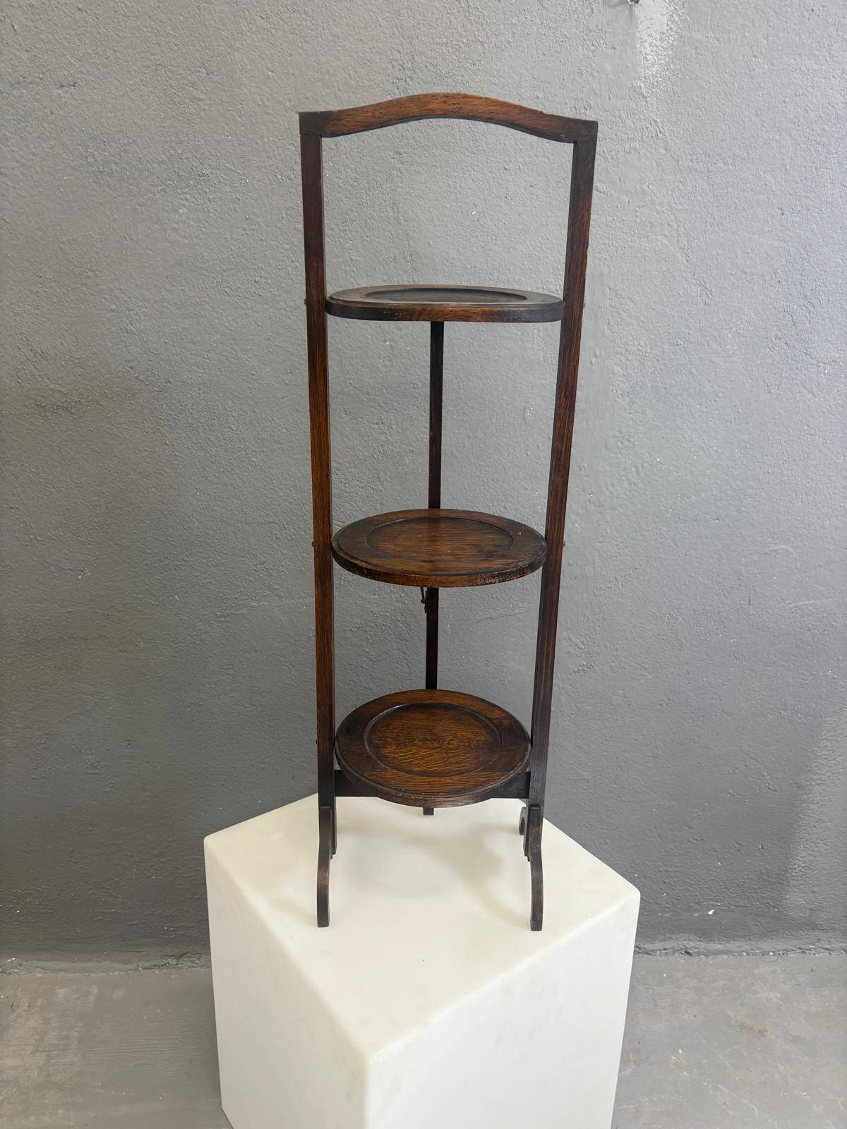 Vintage 3-tier cake stand in dark wood, 1920s serving display.