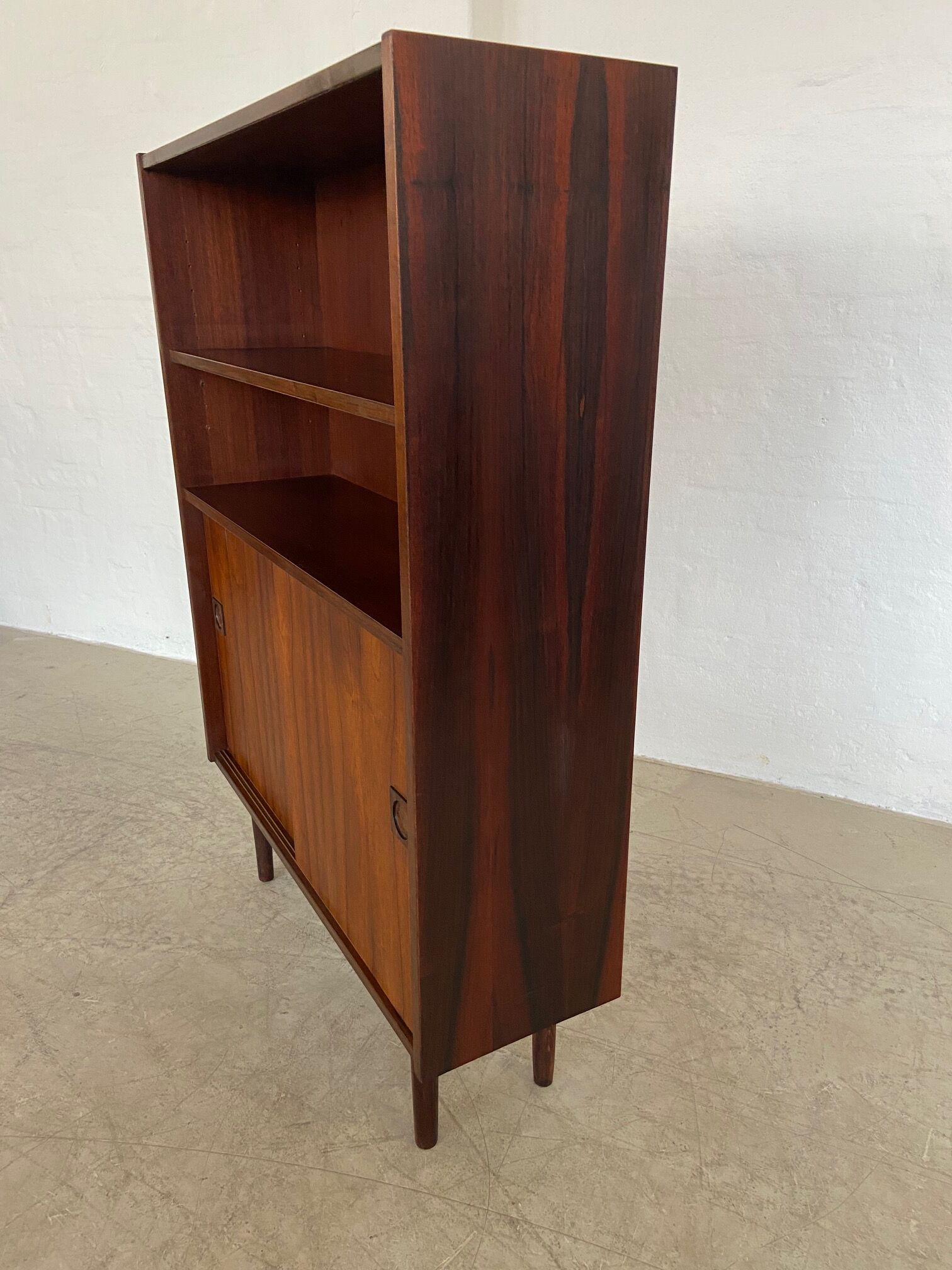 Danish retro vintage library in rosewood with sliding doors from the 1960s.