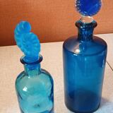 Set of two blue glass bottles