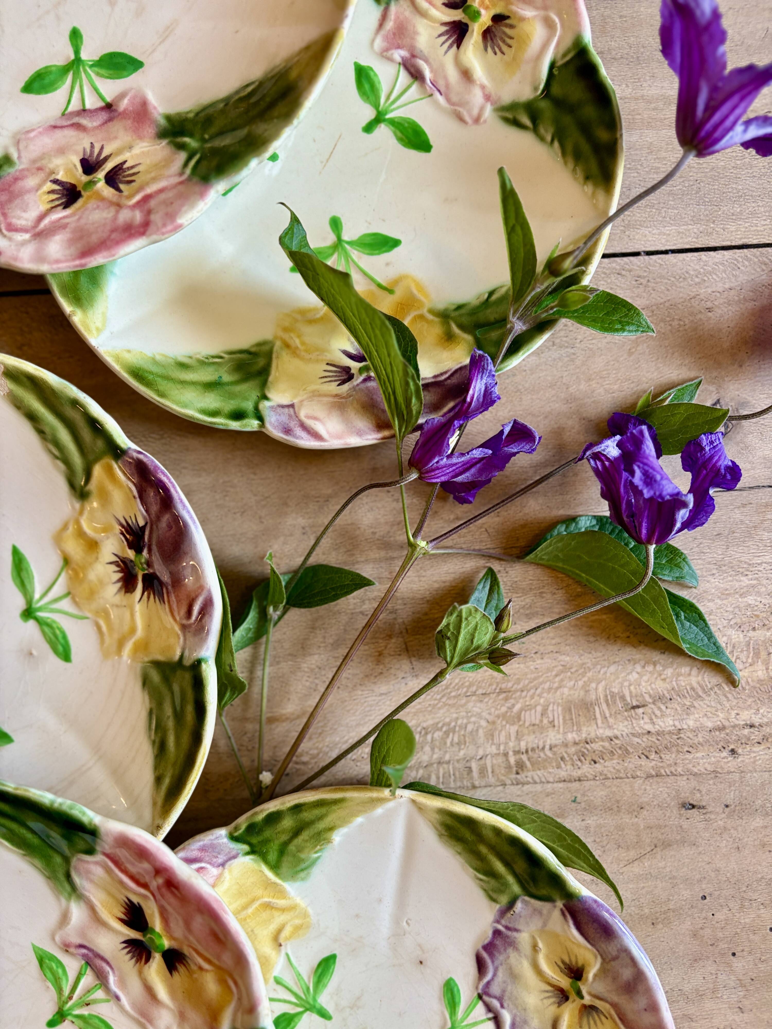 Set of 10 antique slip plates with flower decorations