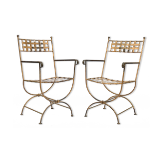 Pair of black and gold iron armchairs