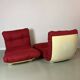 Vintage red shell lounge chairs from the 70s mid-century retro.