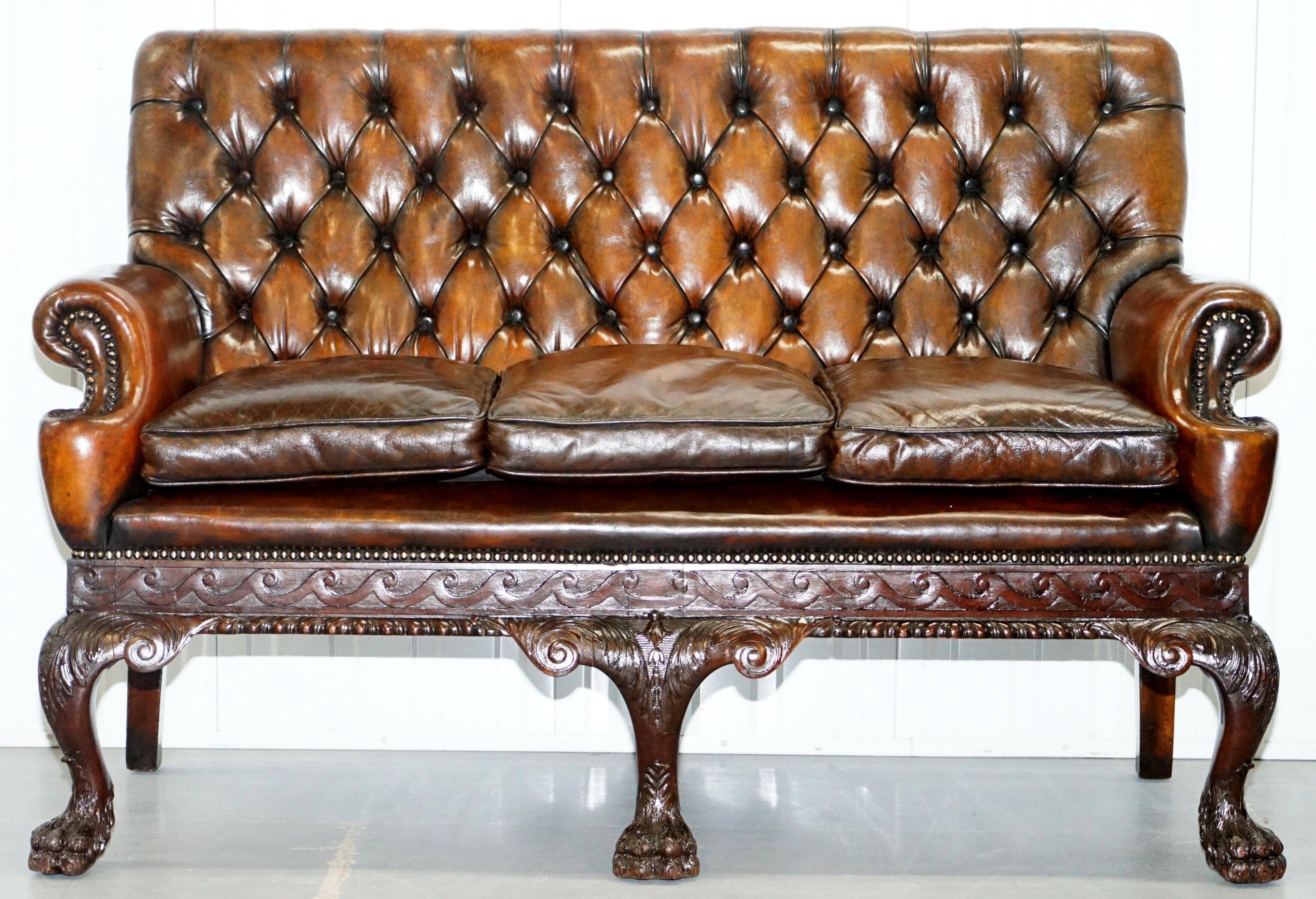 Chesterfield leather canapé in Georgian style with lion paw carved feet.