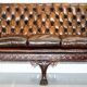 Chesterfield leather canapé in Georgian style with lion paw carved feet.