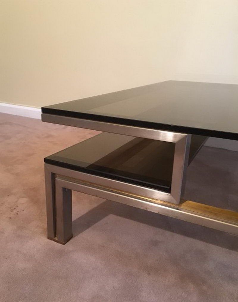 Very nice coffee table in brushed steel and brass