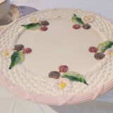 Footed dessert plate in barbotine porcelain, marked FG.