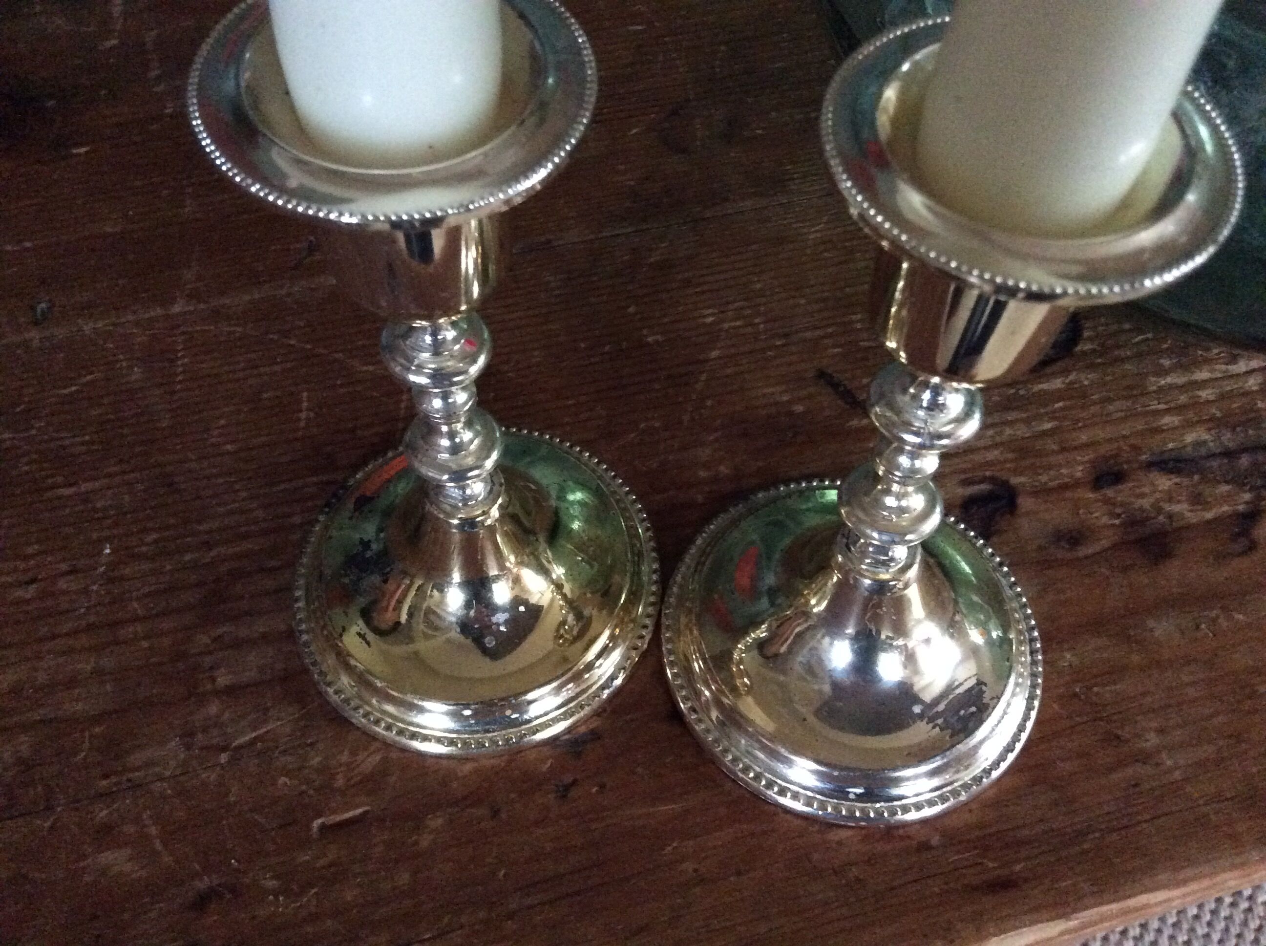 Pair of gold metal candle holders