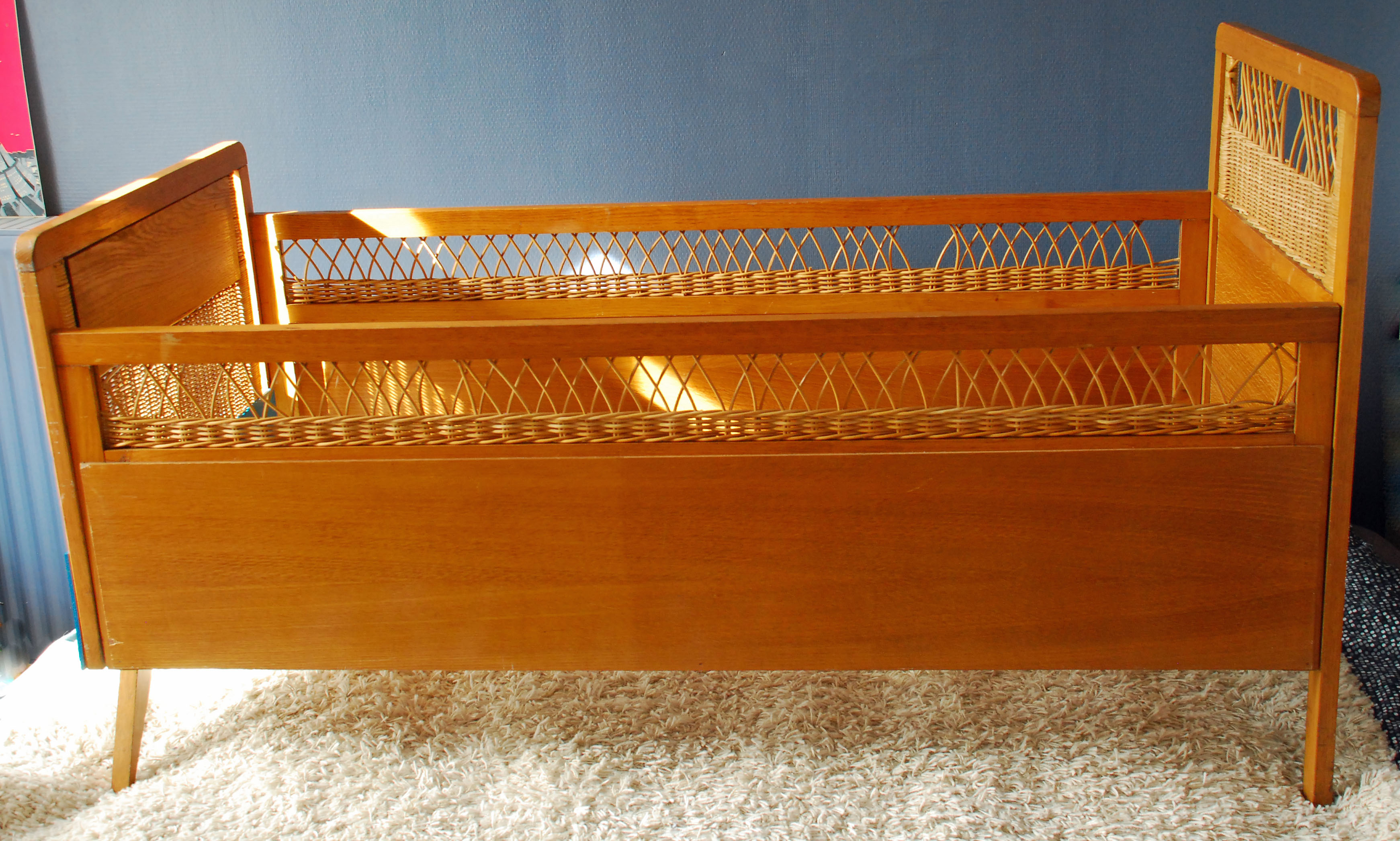Wooden bed and vintage rattan