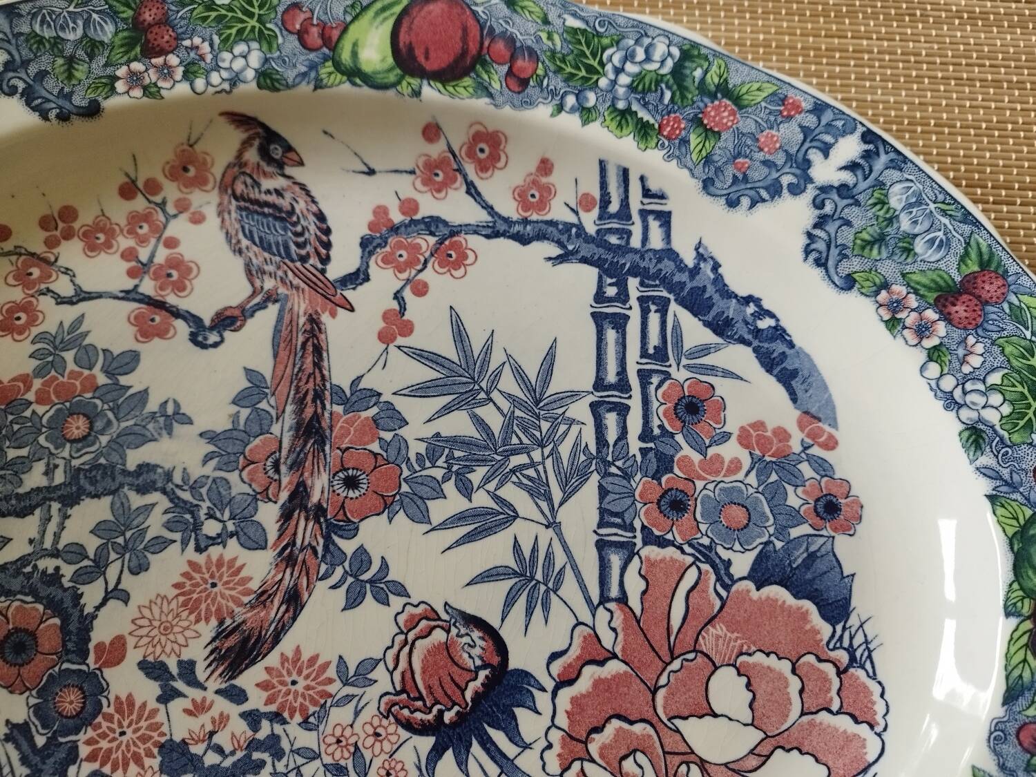 Oval Japanese plate with peacock decoration.