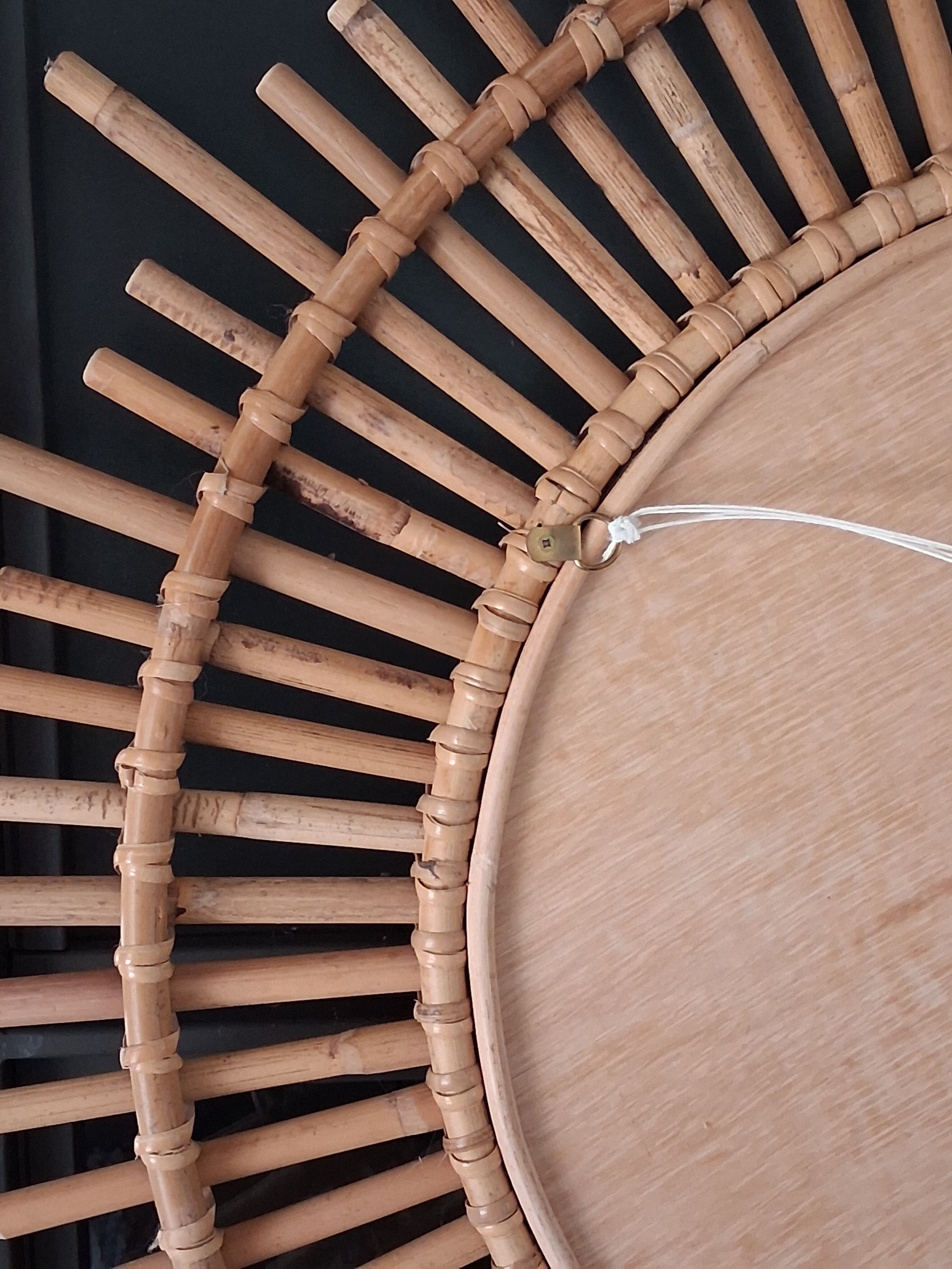 Very large sun mirror in rattan.