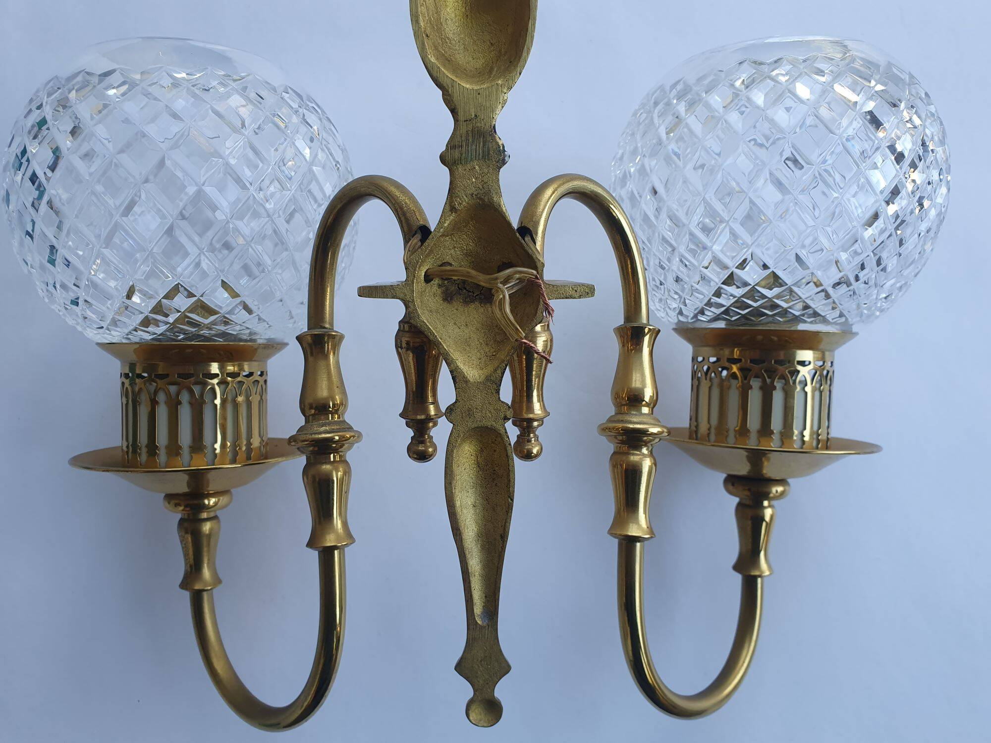 Two-light wall light gold with antique crystal globes