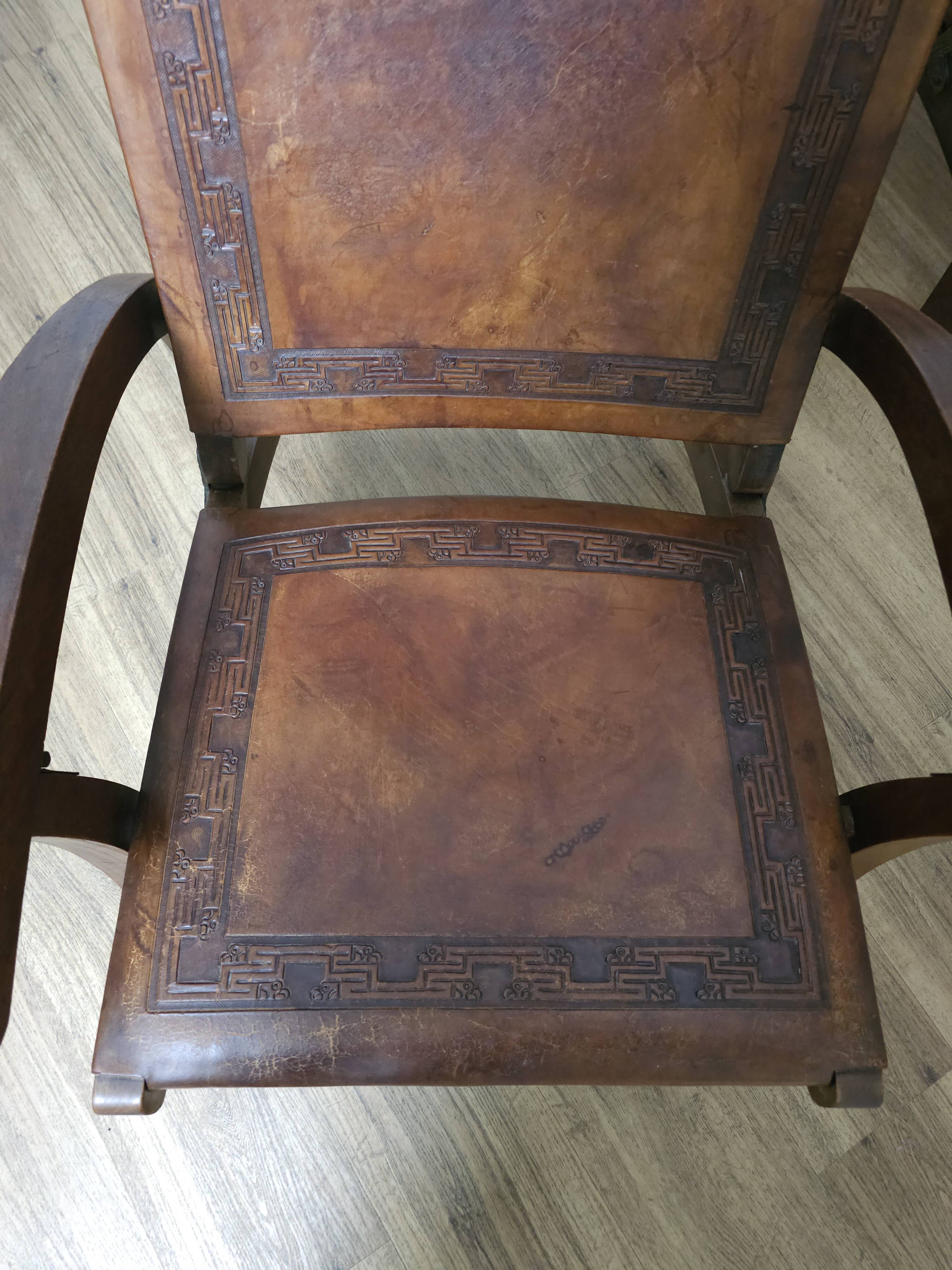 Leather and teak armchairs, by Angel Pazmino, circa 1960.