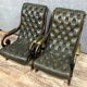 Pair of chesterfield armchairs in leather and stained wood circa 1940