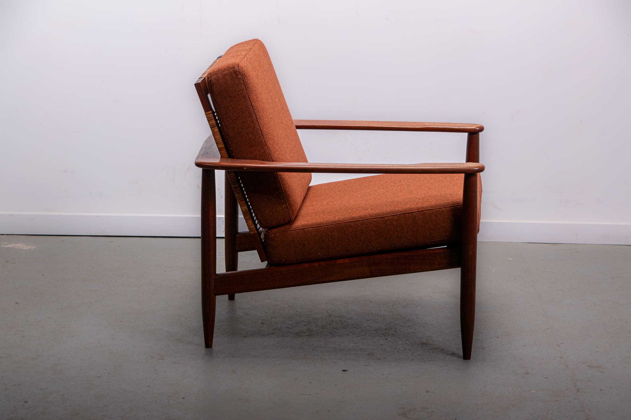 Mid-century easy chair in teak and cane circa 1970