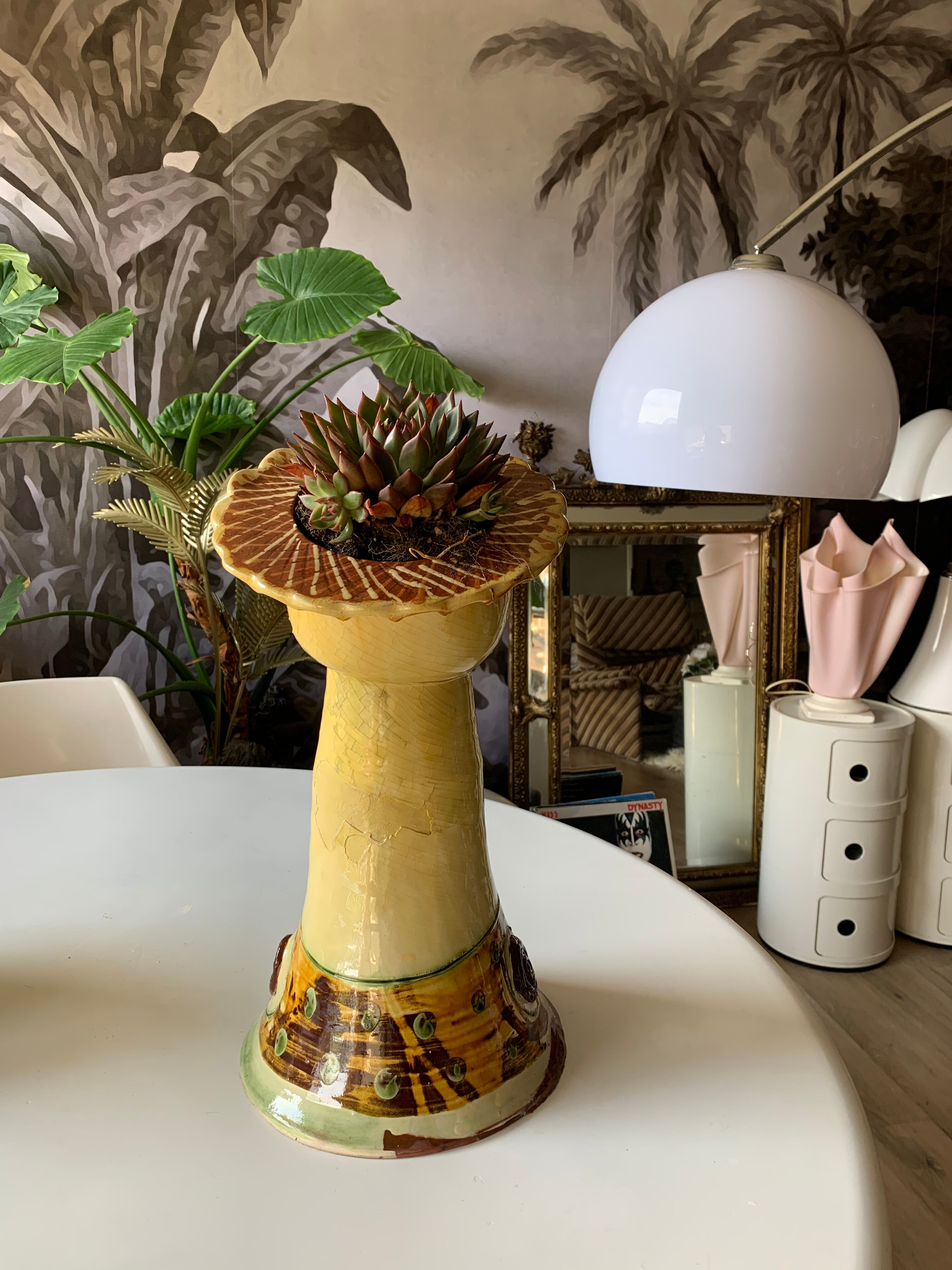 Terracotta plant holder head shape