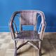 Small child vintage armchair in rattan
