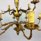 Golden luster with 12 arms of light decorated with leaves 1940