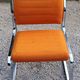 Pair of designer armchairs in orange fabrics and chrome tubes from the 70s