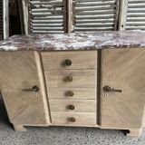 Raw wood chest of drawers with marble top