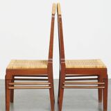 4 wooden Art Deco design dining chairs with a wicker seat and backrest
