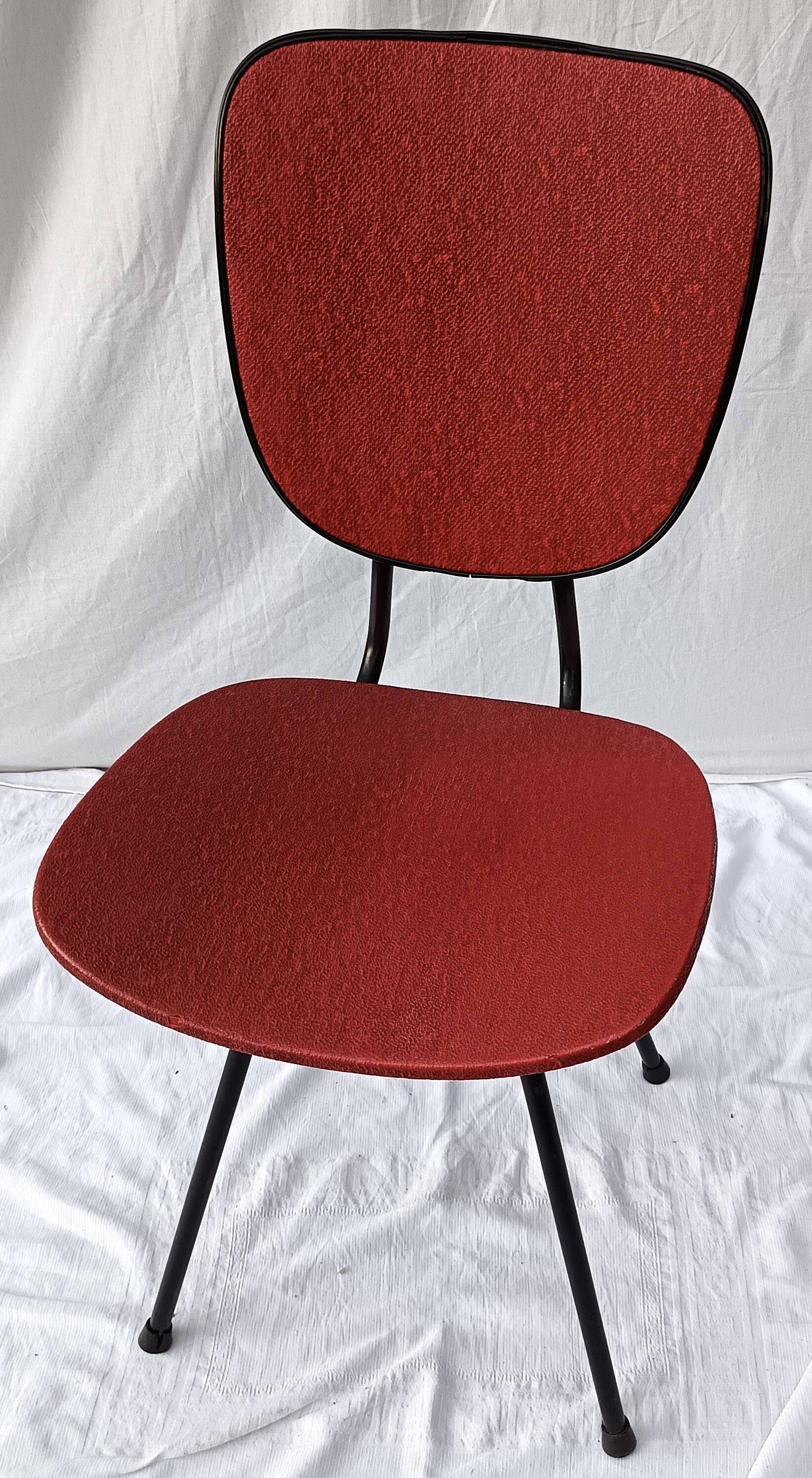 sixties chair with steel tube legs and a skaï seat