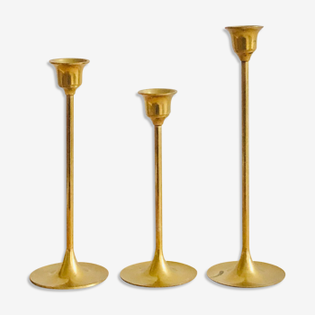 Trio of vintage brass candle holders