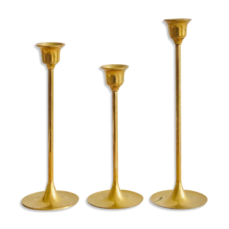 Trio of vintage brass candle holders