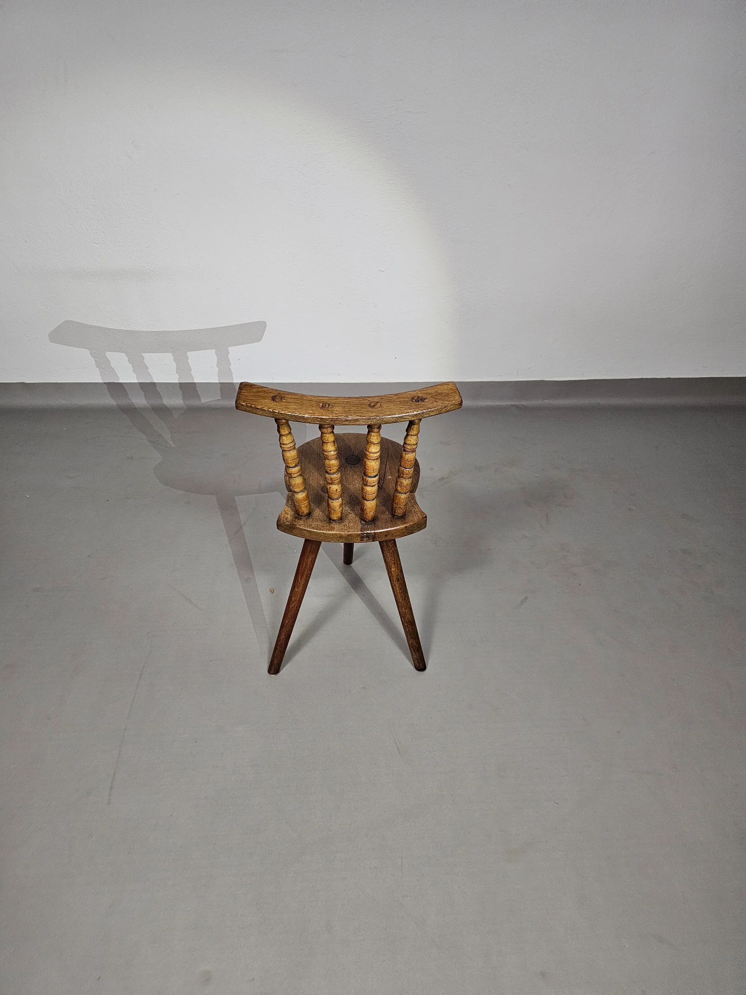 Old farmers tripod chair for decorative use