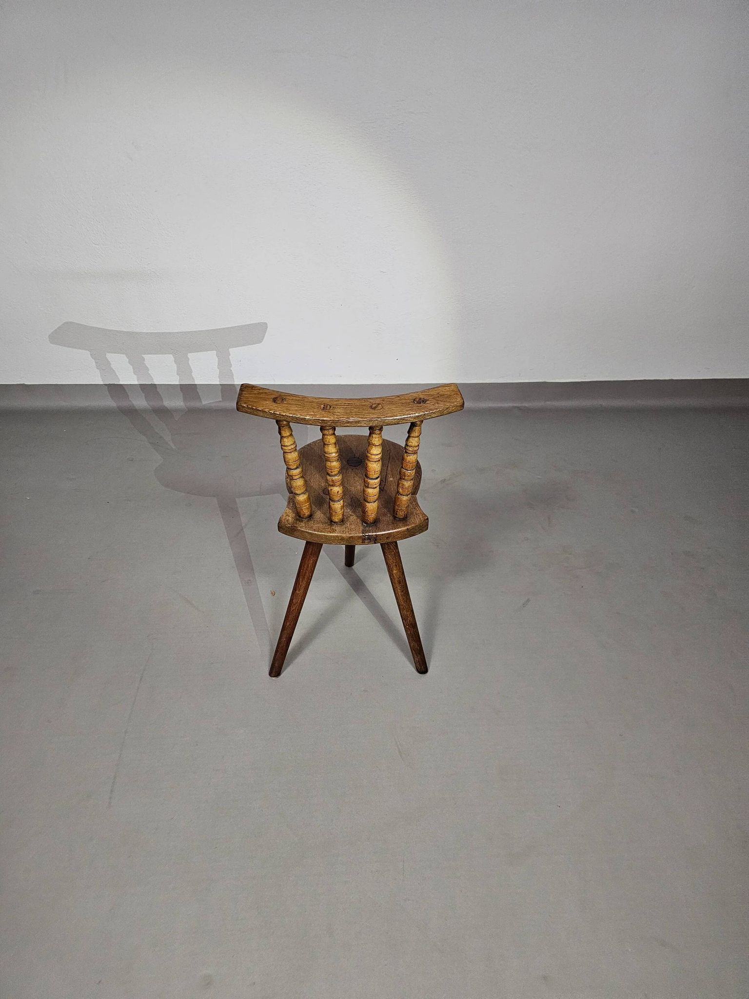 Old farmers tripod chair for decorative use
