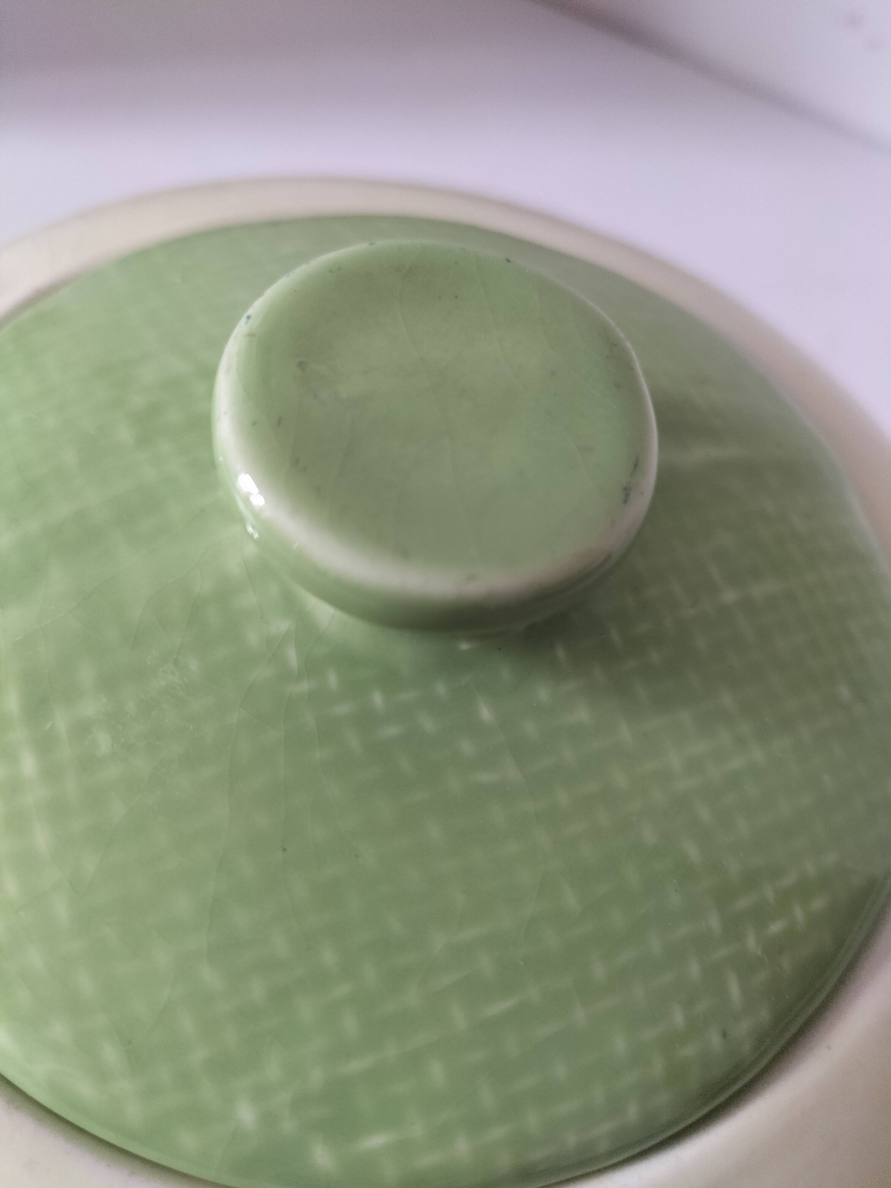 Two sugar bowls and a textured plate in turquoise and green Salins earthenware.