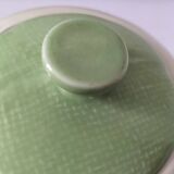 Two sugar bowls and a textured plate in turquoise and green Salins earthenware.