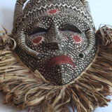 African mask with raffia and kaolin dots
