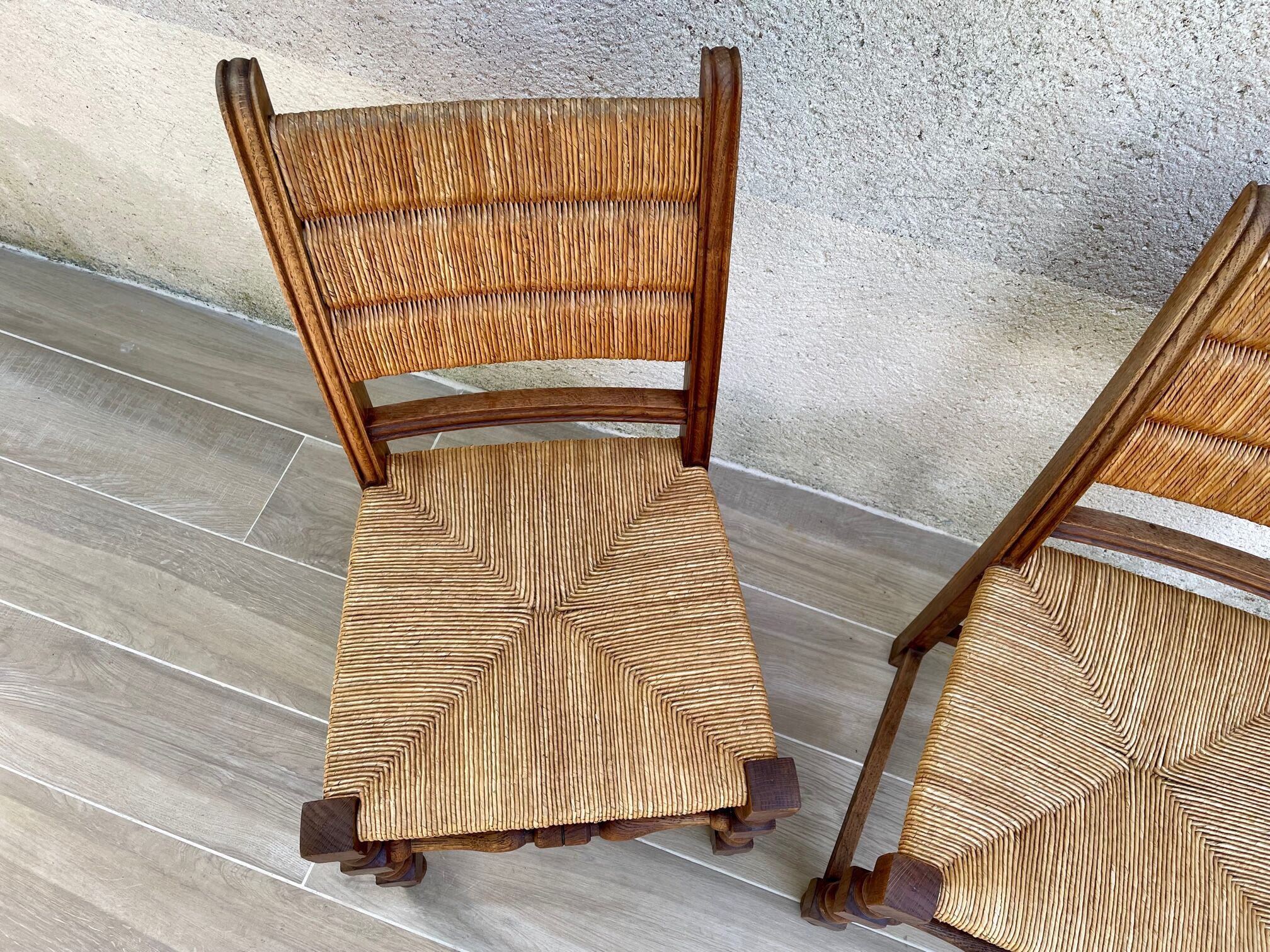 Pair of straw and solid oak chairs