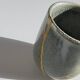 A pair of artisanal cups in traditional kintsugi.