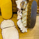 1960s wicker cradle with mattress and drapes.
