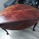 Élégante table ovale antique à abattants