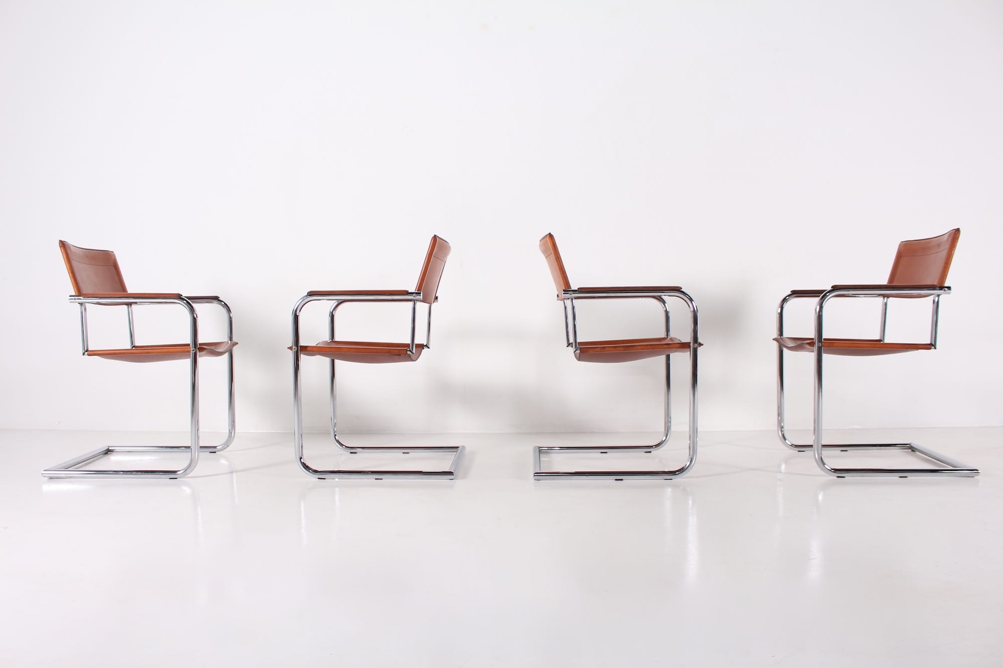 4 Matteo Grassi leather cogna cantilever armchairs