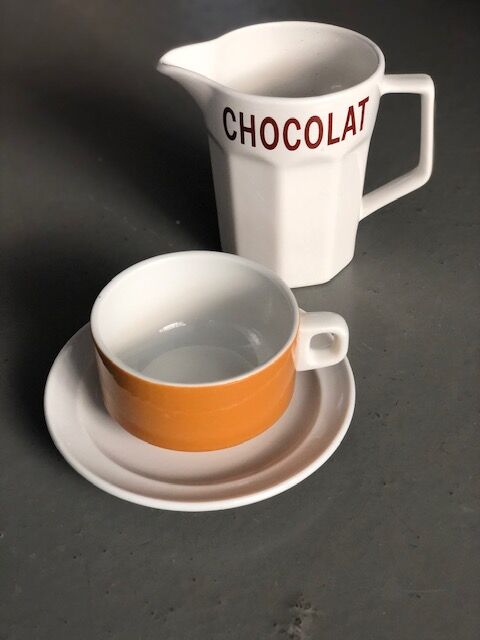 Hot chocolate cups and milk jar
