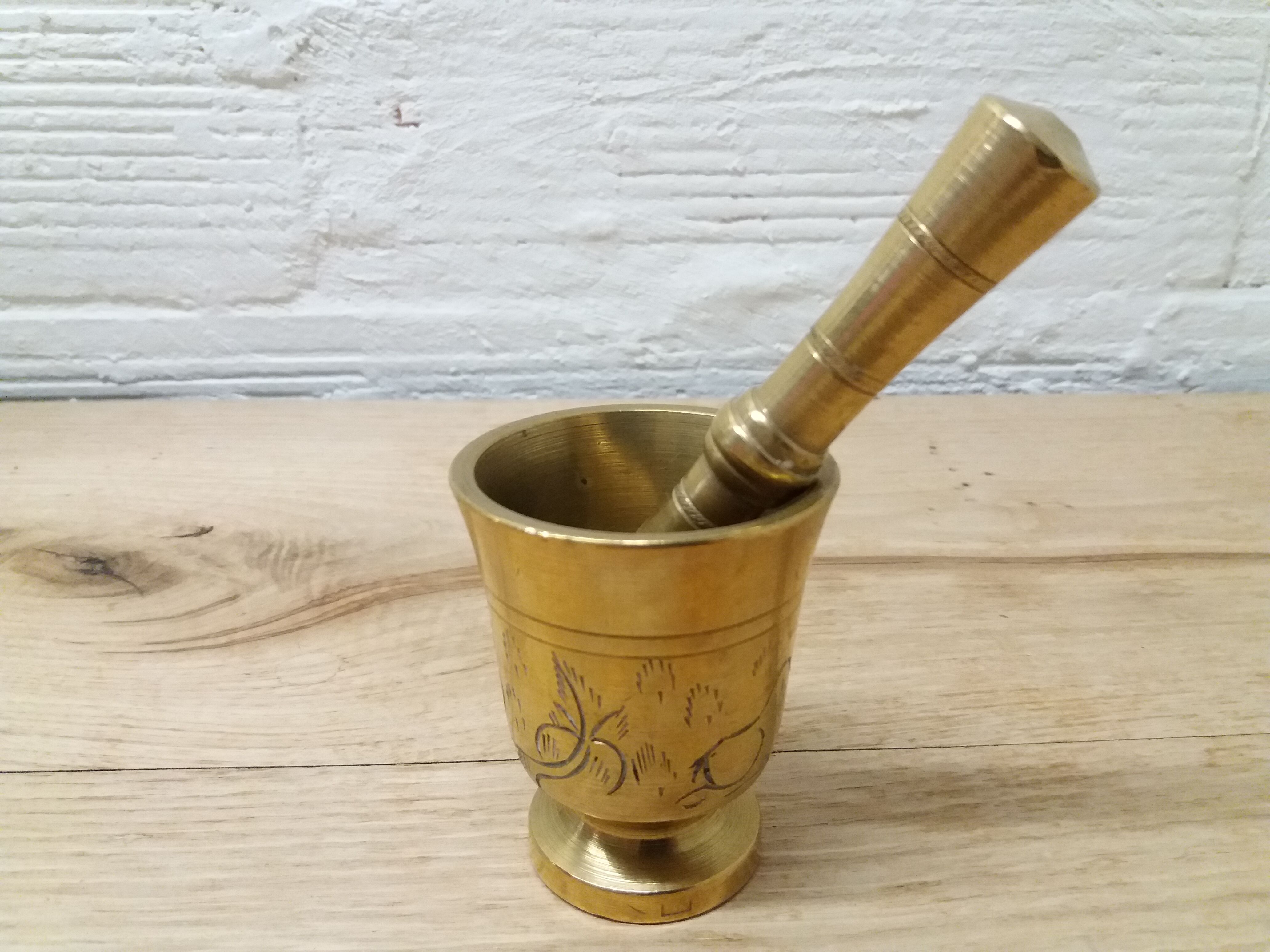Golden brass mortar and pestle