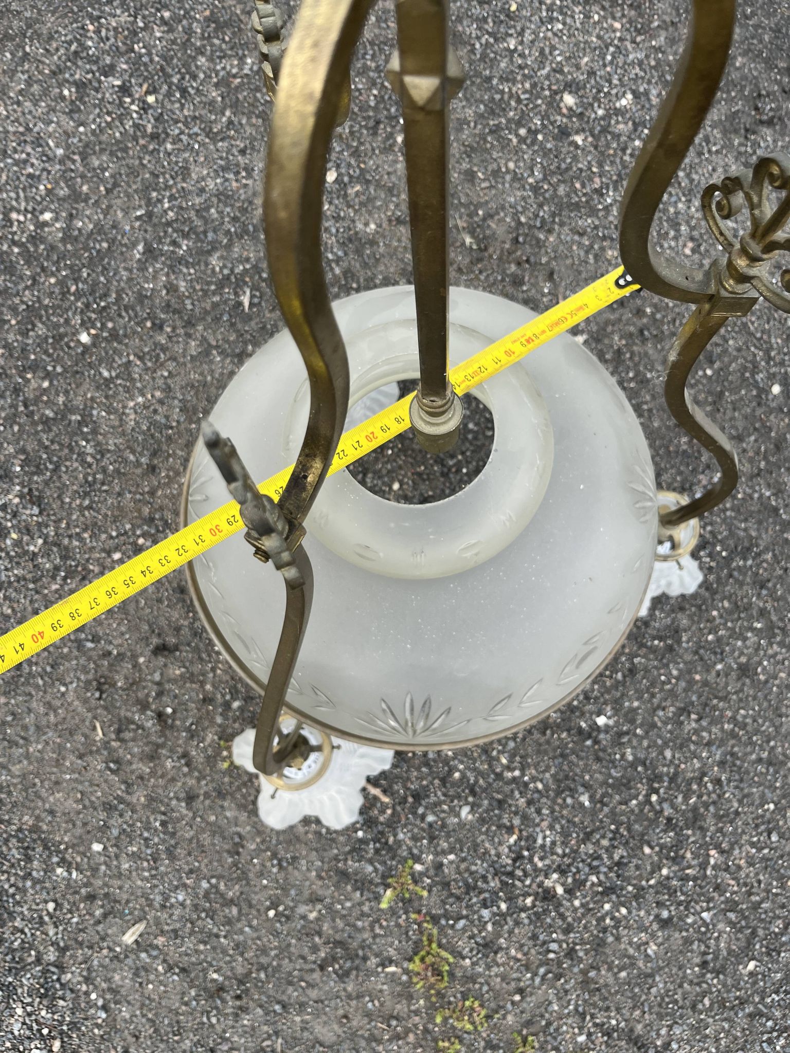 Antique brass chandelier with 3 lights and frosted glass shades.