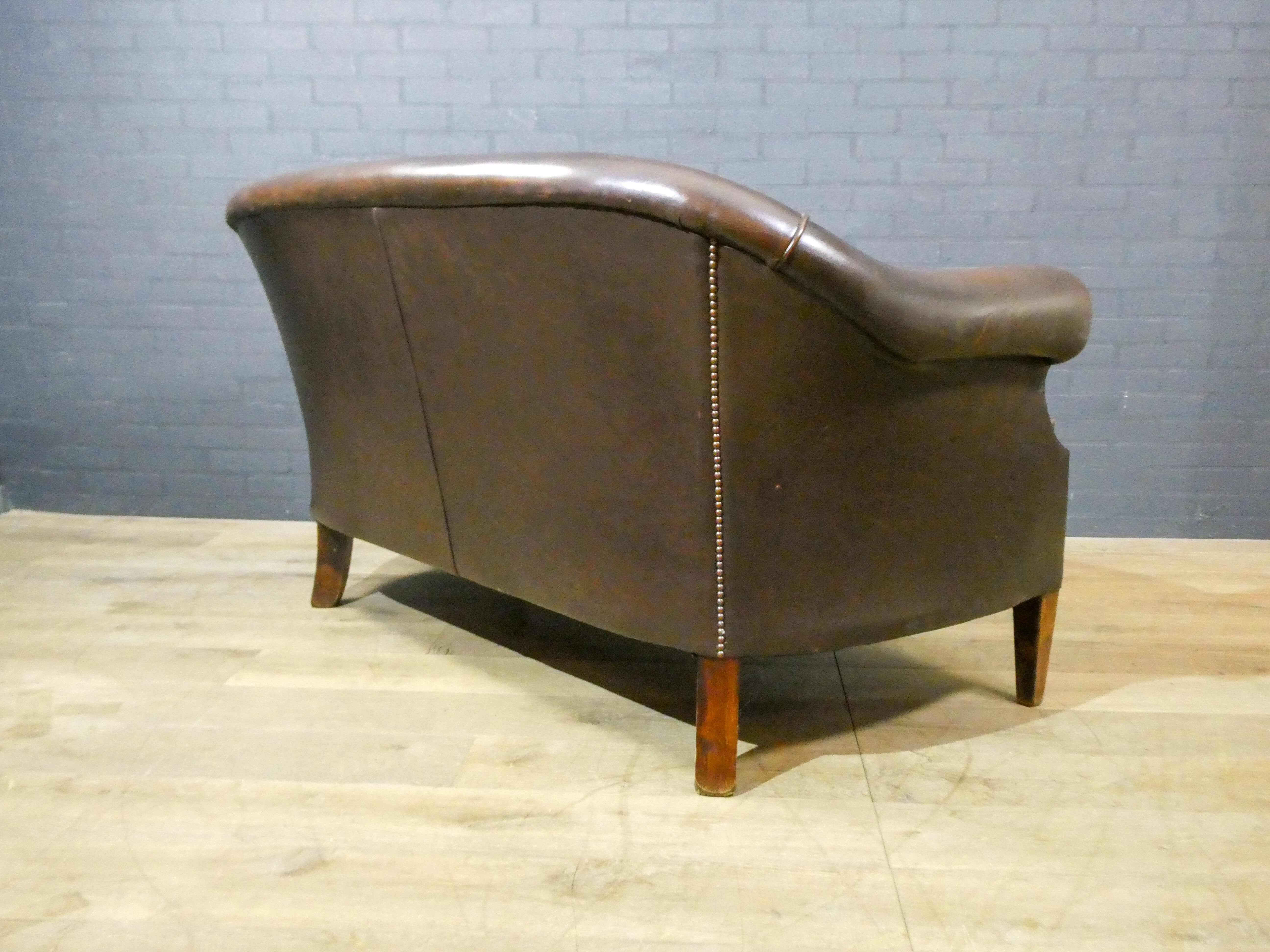 Vintage leather 2-seater sofa in dark brown